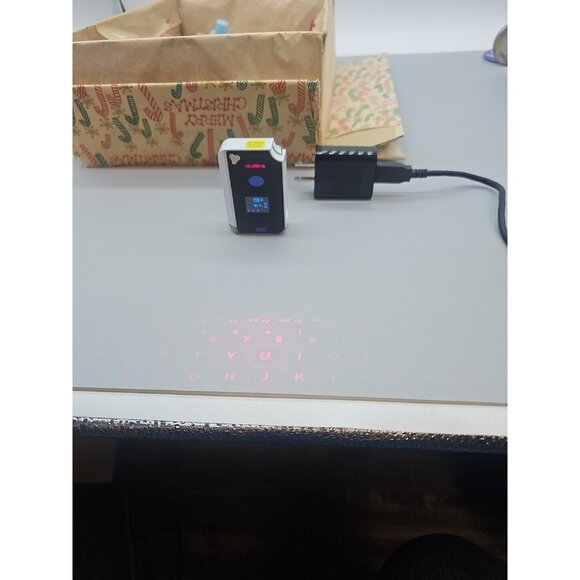Brookstone CTX (Model: VK200 Keyfob) BT Virtual Bluetooth Keyboard